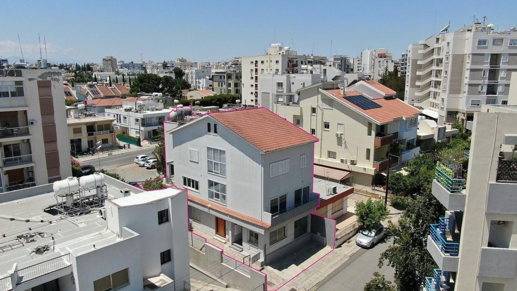 Three storey semi-detached mixed use building with shop in Strovolos, Nicosia | Photo 1