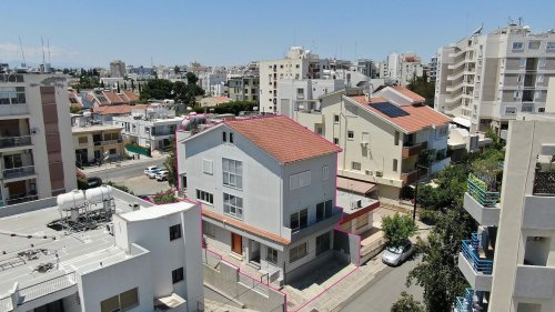 Three storey semi-detached mixed use building with shop in Strovolos, Nicosia - Image 1