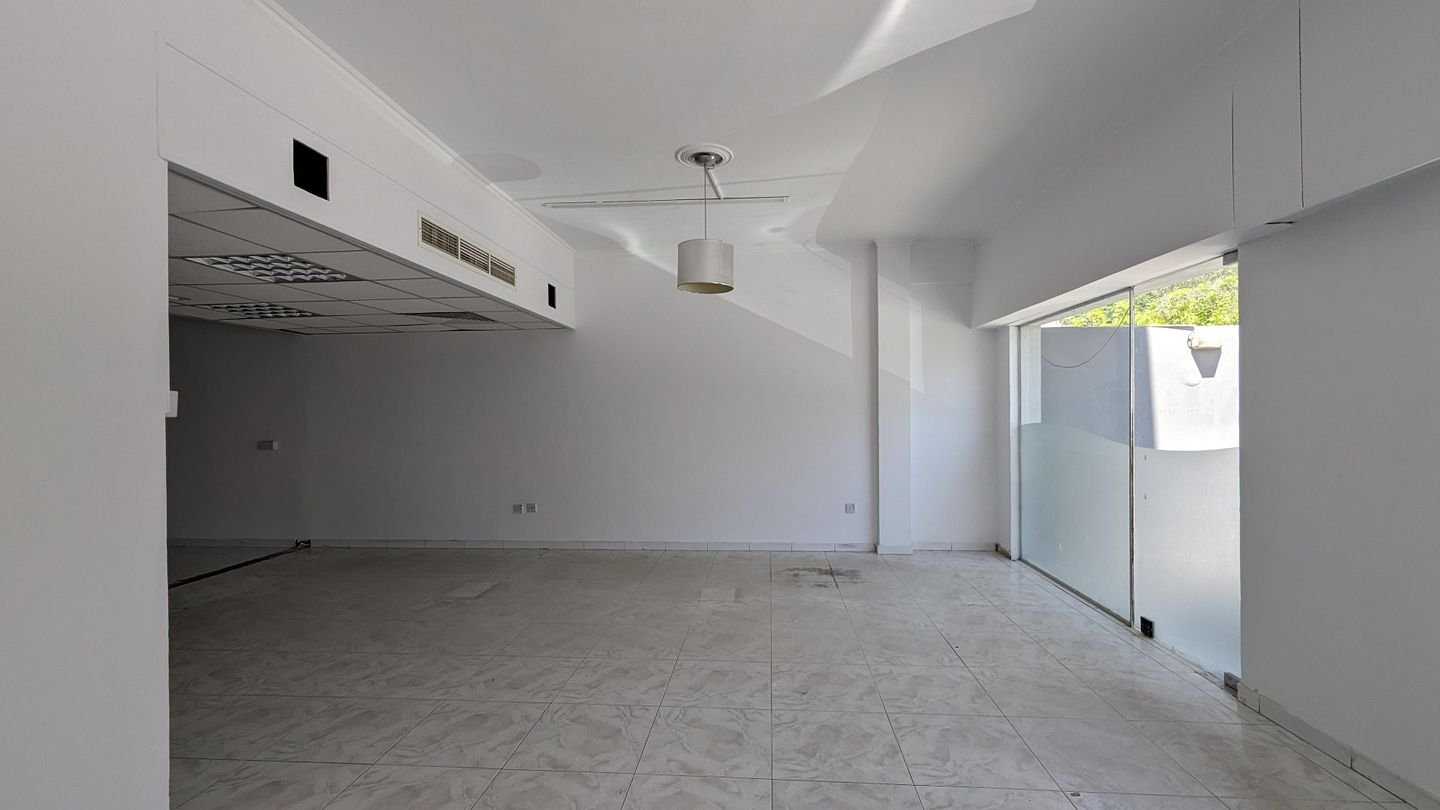 Three storey semi-detached mixed use building with shop in Strovolos, Nicosia photo 20