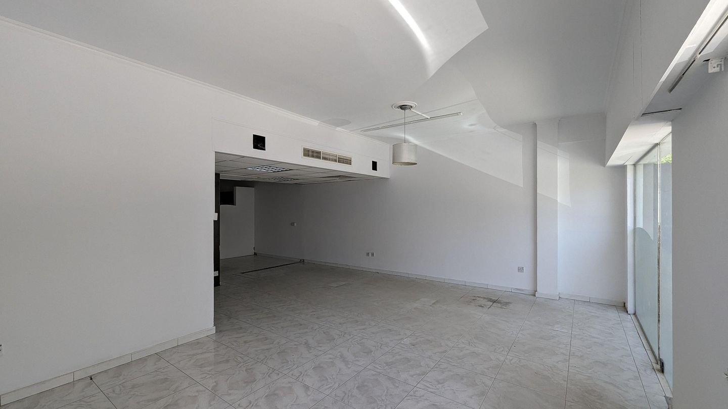 Three storey semi-detached mixed use building with shop in Strovolos, Nicosia photo 24