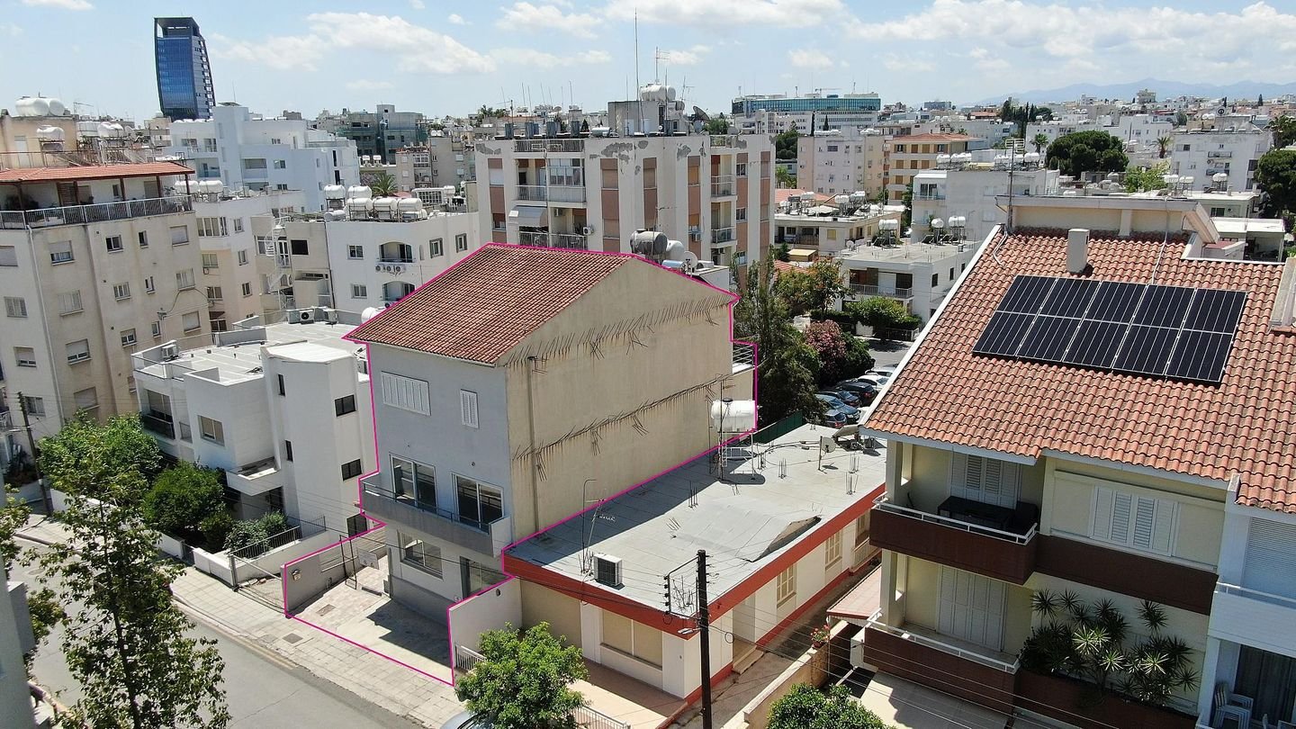 Three storey semi-detached mixed use building with shop in Strovolos, Nicosia photo 2