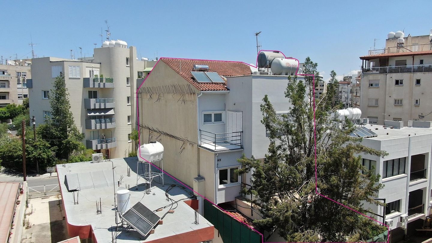 Three storey semi-detached mixed use building with shop in Strovolos, Nicosia photo 3